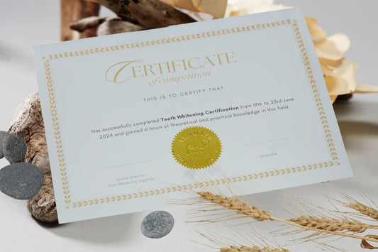 Image of a teeth whitening certification certificate for British Colombia in a flat-lay
